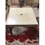 A VINTAGE RETRO SQUARE TABLE ON ORIGINAL LEGS AND CASTORS