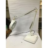 AN ADJUSTABLE DAY LIGHT MAGNIFYING GLASS LIGHT