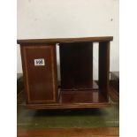 A REVOLVING MAHOGANY INLAID BOOKSHELF