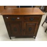 AN ART NOUVEAU TWO DRAWER CABINET