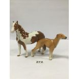 A BESWICK FIGURE OF A HORSE, 18CM LONG, TOGETHER WITH A POTTERY FIGURE OF A GREYHOUND