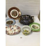 AN ASSORTMENT OF CERAMICS INCLUDING DECORATIVE WALL PLATES AND A LARGE TWIN HANDLED DISH