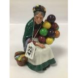 A ROYAL DOULTON FIGURE OF A LADY "THE OLD BALLOON SELLER" HN 1315