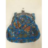 A VINTAGE BUTLER AND WILSON HANDBAG HIGHLY DECORATED WITH EMBROIDED AND BEAD DETAILING ON BLUE