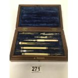 A SET OF VICTORIAN DRAWING INSTRUMENTS IN A WALNUT CASE OF RECTANGULAR FORM, 20CM WIDE