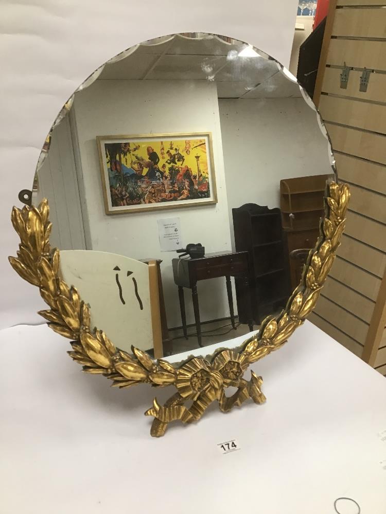 A LARGE 20TH CENTURY TABLE BEVELLED EDGED MIRROR OF CIRCULAR FORM, THE LOWER HALF OF WHICH WITH GILT