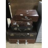 FIVE VINTAGE SUITCASES