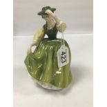 A ROYAL DOULTON FIGURE OF A LADY "BUTTERCUP" HN 2399