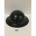 A MID CENTURY MILITARY HELMET, RUBBED MARK TO INSIDE 'USS 1041' 31CM WIDE
