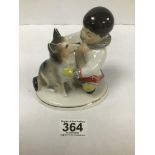 A 20TH CENTURY USSR PORCELAIN FIGURE BY LOMONOSOV OF AN INUIT BOY WITH HUSKY, 13.5CM HIGH