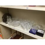 A LARGE QUANTITY OF ASSORTED CUT GLASS WARE, INCLUDING WINE GLASSES, WATER JUGS AND MORE