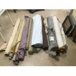 A QUANTITY OF FABRIC AND MATERIAL, MOST IN LARGE REELS