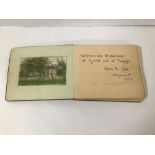 AN EARLY 20TH CENTURY LEATHER BOUND SKETCH AND AUTOGRAPH ALBUM, INCLUDING DRAWINGS, POEMS,