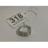A 10K WHITE GOLD RING SET WITH FOUR ROWS OF 12 DIAMONDS, 48 IN TOTAL, RING SIZE N, 4.25G
