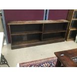 A LOW OAK BOOKCASE 182 X 28 X 74CMS