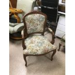 AN UPHOLSTERED OAK ARMCHAIR, 90CM HIGH