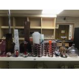 A LARGE QUANTITY OF ASSORTED COLOURED GLASS, INCLUDING FOUR PAPERWEIGHTS, VARIOUS VASES AND MORE,