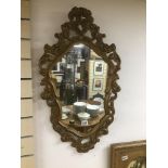 A VINTAGE GILDED MIRROR 82 X 48CMS