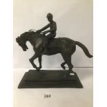 A CAST BRONZE FIGURE OF A JOCKEY ON HORSEBACK, MOUNTED UPON TIERED BASE, 32.5CM HIGH