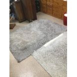TWO SHAG PILE FURRY RUGS, LARGEST 240CM BY 165CM