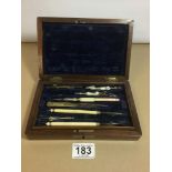 A SET OF VICTORIAN DRAWING INSTRUMENTS IN A WALNUT CASE OF RECTANGULAR FORM, 20CM WIDE