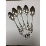A SET OF FIVE EARLY 20TH CENTURY SILVER TEASPOONS WITH PIERCED FOLIATE TERMINALS, HALLMARKED