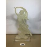 A VINTAGE RESIN FIGURE OF A STYLISH LADY WEARING A RISQUE FLOWING DRESS, 31CM HIGH