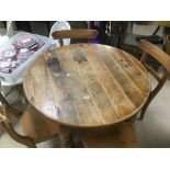 A VICTORIAN PINE TABLE WITH FOUR PINE CHAIRS