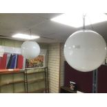 TWO LARGE MILK GLASS GLOBE SHAPED CEILING LIGHTS FROM HOVE MUSEUM