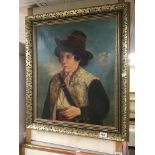A SIGNED FRAMED OIL ON CANVAS OF A 19TH CENTURY YOUNG MAN BY F.E.D 1912 65 X 75CMS