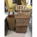 A WICKET BASKET, THREE WOODEN CRATES AND A WOODEN UMBRELLA STAND