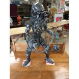A METAL PREDATOR MADE FROM MOTOR PARTS 64CMS