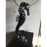 A METAL SEAHORSE MADE FROM MOTOR PARTS 64CMS