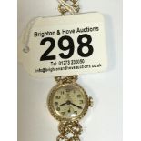 AN EARLY LADIES 9CT GOLD CASED TUDOR ROYAL WRISTWATCH ON 9CT GOLD FIGURE OF EIGHT ROPETWIST STRAP,