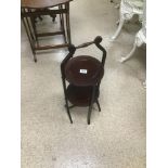 A MAHOGANY TWO TIER FOLDING CAKE STAND