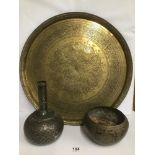 A LARGE MIDDLE EASTERN BRASS CHARGER WITH HIGHLY ENGRAVED DECORATION THROUGHOUT, 55CM DIAMETER,