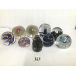 A GROUP OF TEN COLOURED GLASS PAPERWEIGHTS, INCLUDING A CAITHNESS PEBBLE AND CAITHNESS MORNING DEW