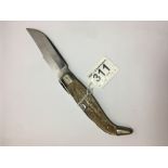 A VINTAGE FOLDING KNIFE WITH 'INOXIDABLE' BLADE, 22CM LONG