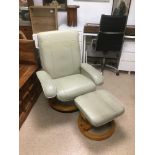 A STRESSLESS STYLE ARMCHAIR WITH FOOTSTOOL