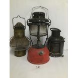 THREE OIL LAMPS, ONE BEING A SHIP/TRAIN LANTERN, LARGEST 33CM HIGH