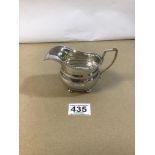 A GEORGE V SILVER MILK JUG WITH GADROONED BORDER, RAISED UPON FOUR BUN FEET, HALLMARKED BIRMINGHAM