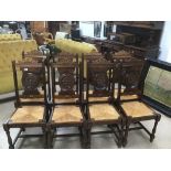 A SET OF EIGHT CARVED DINING CHAIRS WITH WICKER SEATS, 107.5CM HIGH