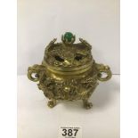 A CHINESE GILT BRONZE CENSOR/INCENSE BURNER RAISED UPON LION PAW TRIPOD FEET, TWIN HANDLED STAMPED