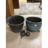TWO EARLY CAST METAL PLANT POTS, LARGEST 32CM HIGH, TOGETHER WITH A BRASS OIL CAN AND ANOTHER