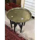 A MIDDLE EASTERN BRASS ENGRAVED TABLE 58 CM DIAMETER