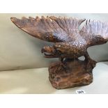 A LARGE CARVED WOODEN FIGURE OF AN EAGLE, 61CM WIDE