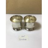 A PAIR OF SMALL SILVER BEAKERS OF CIRCULAR FORM, HALLMARKED BIRMINGHAM 1943 BY JAMES GLOSTER LTD,