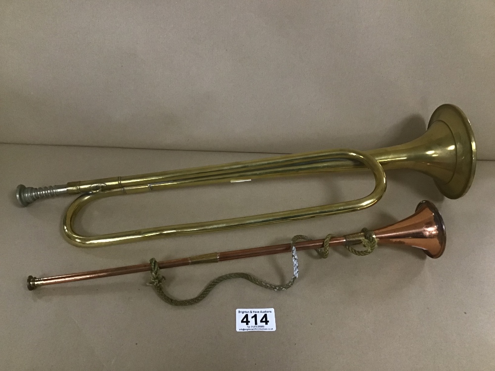 A BRASS AND COPPER HORN INSTRUMENT