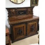 A CONTINENTAL 19TH CENTURY HEAVILY CARVED BUFFET SIDEBOARD CARVED WITH ANIMALS AND FRUIT HEIGHT