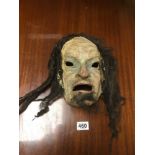 A GROTESQUE PAPER MACHE MASK